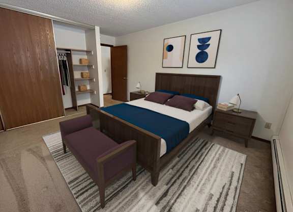 A bedroom with a bed, nightstand, and chair.