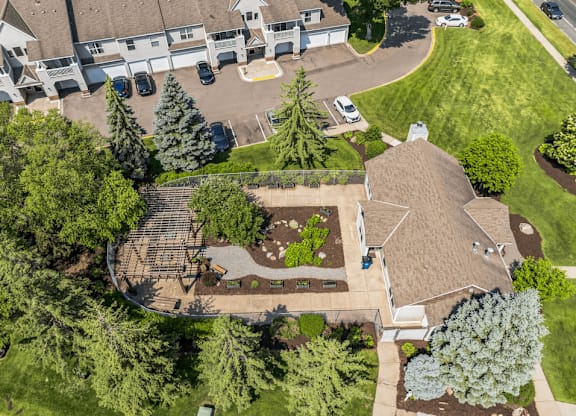 an aerial view of a home with a landscaped yard