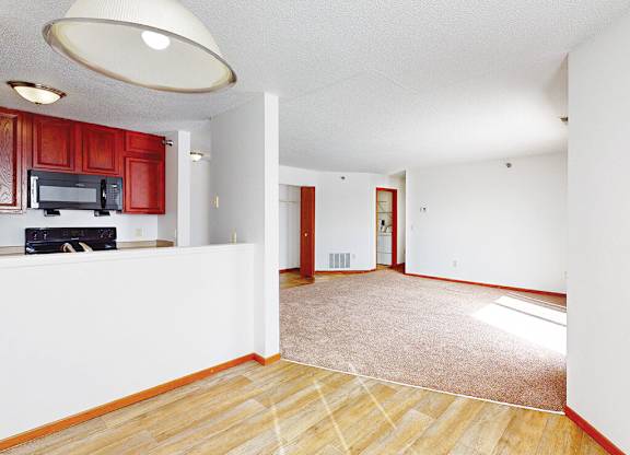 A living room with a television and a microwave.