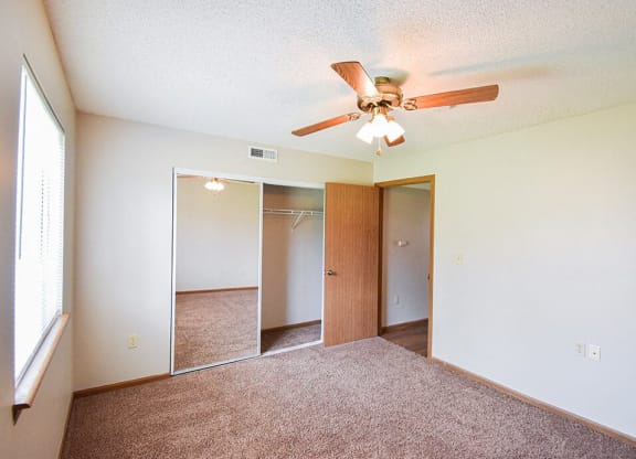 carpeted bedroom with natural light