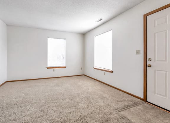 carpeted living area with natural light
