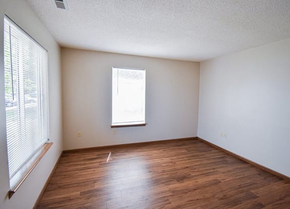 Living Room with window and hardwood style flooring