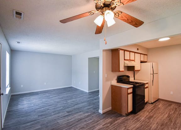 kitchen and dining area with hardwood style flooring