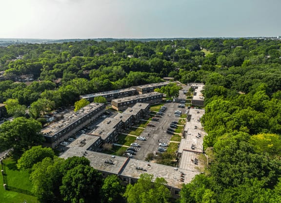 an aerial view of an abandoned building surrounded by trees