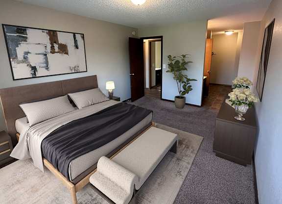 a bedroom with a large bed and a large painting on the wall