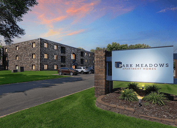 a view of the park meadows apartments from the street