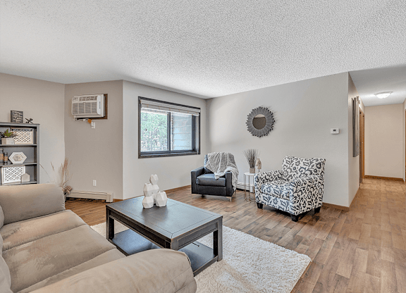 a living room with a couch and two chairs