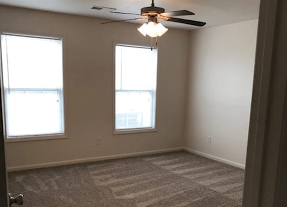 Large bedroom with lots of lighting at the brickyard apartments