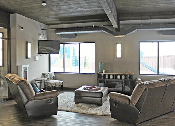 a living room with a tv and couches