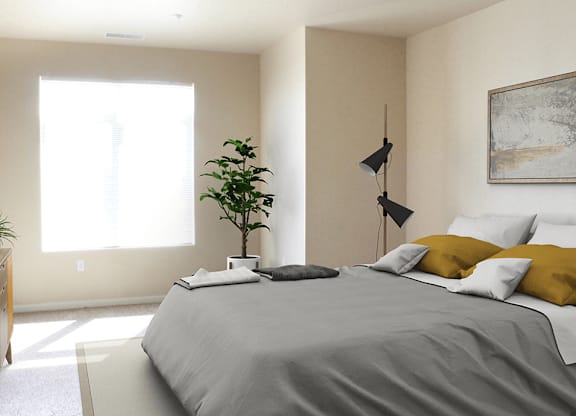 a bedroom with a large bed and a plant in the corner of the room
