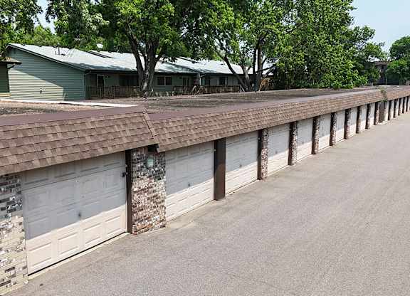 A long row of garage doors are closed.