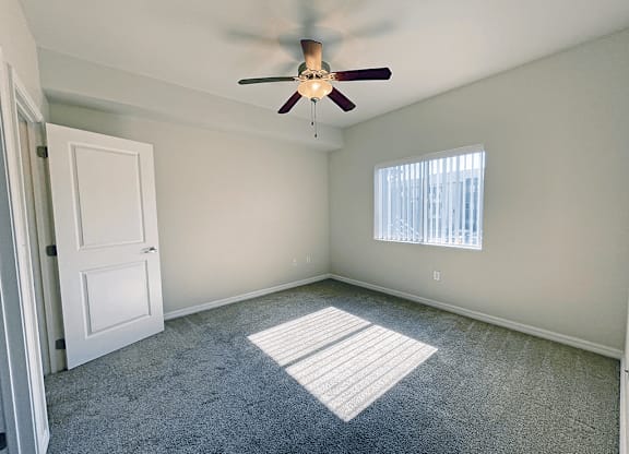 Apartment bedroom with blinds on window