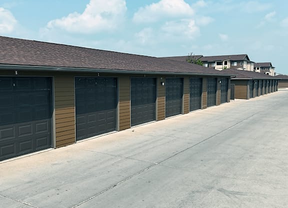 A long row of garage doors are closed.