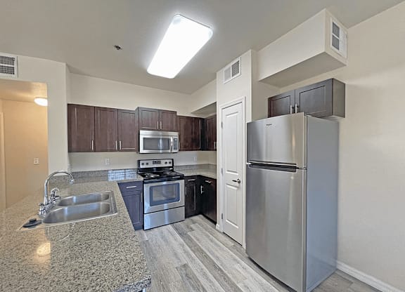 A kitchen with double bowl sink