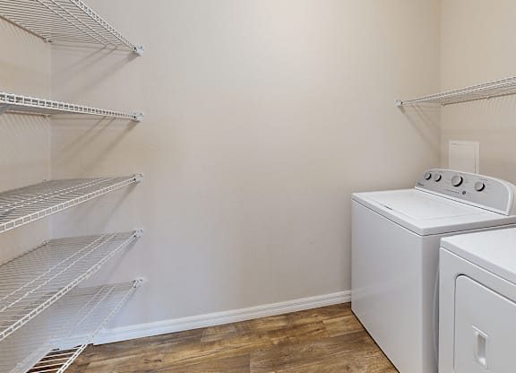 A laundry room with a washer and dryer.