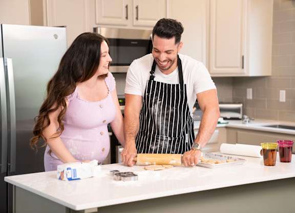 A man and a woman are preparing food in a kitchen. at Habitat @ DTLV, Nevada