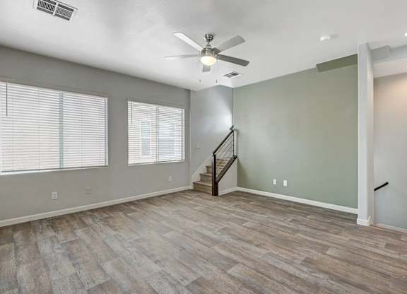 A room with a staircase and a ceiling fan. at Habitat @ DTLV, Las Vegas, NV