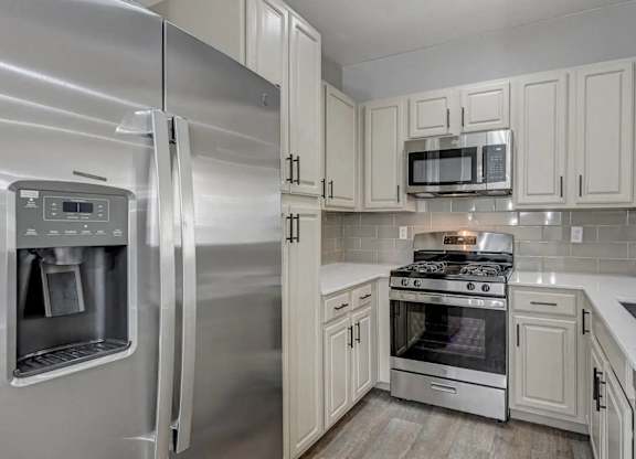 A modern kitchen with a stainless steel refrigerator and oven. at Habitat @ DTLV, Las Vegas, NV, 89106