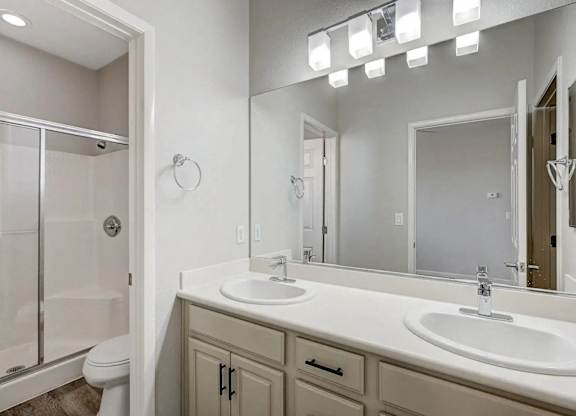 A bathroom with a white sink and a mirror. at Habitat @ DTLV, Las Vegas, NV, 89106