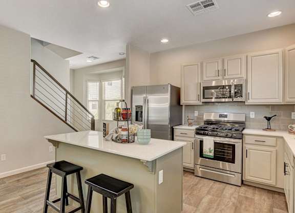 A kitchen with a stainless steel refrigerator, oven, and microwave. at Habitat @ DTLV, Las Vegas, NV, 89106