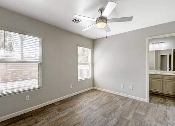 A room with a ceiling fan and wooden flooring. at Habitat @ DTLV, Las Vegas, NV