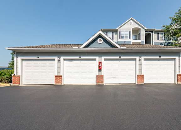 A two-car garage is attached to a house.