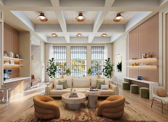 A modern living room with a large window, a sofa set, and a rug.