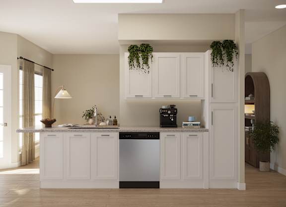 A kitchen with white cabinets and a dishwasher.