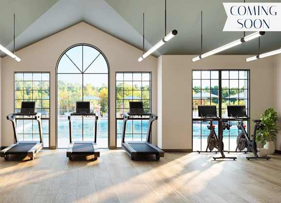 A gym with treadmills and a sign that says "coming soon".