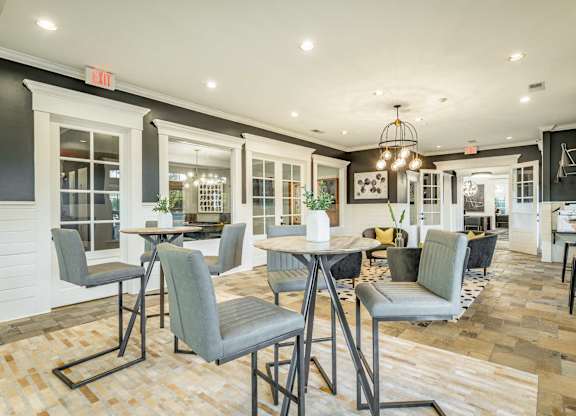 A dining area with a table and chairs.