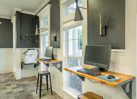 A room with a desk and a computer.