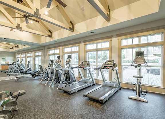 A gym with treadmills and exercise bikes.