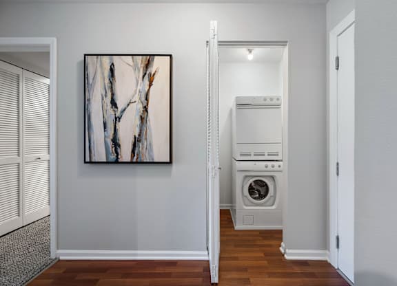 A modern laundry room with a washer and dryer.
