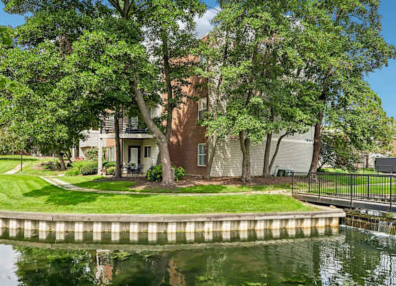 A house with a tree in front of it.