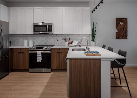 a kitchen with a white counter top and a sink at 2929 on Mayfair, Wisconsin
