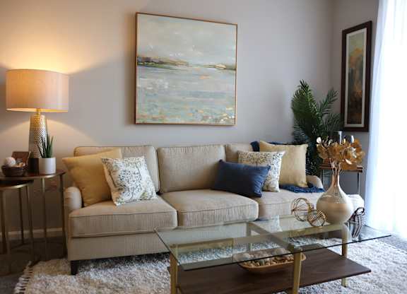 Spacious Living Rooms with Patio/Balcony at Landings at Amhurst Lake Apartments, Waukegan, IL