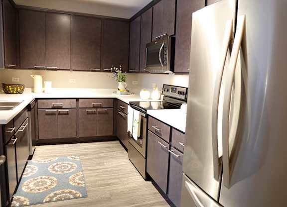 Renovated Kitchen with Stainless Appliances at Landings at Amhurst Lake Apartments, Waukegan, IL