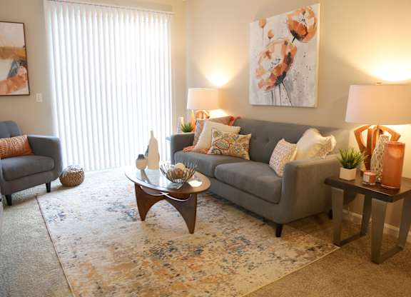 Spacious Living Rooms with Patio/Balcony at Landings at Amhurst Lake Apartments, Waukegan