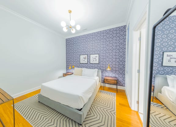 White interior design bedroom at Wells Place Apartments, Chicago, 60607