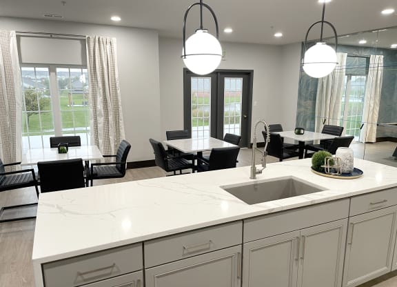 an open kitchen and dining area in a new home