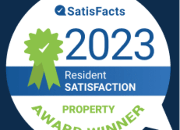 A badge indicating a property award winner for resident satisfaction in 2023.