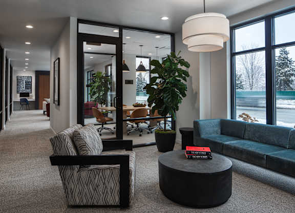a living room with couches and chairs and a table at 2929 on Mayfair, Wauwatosa, WI