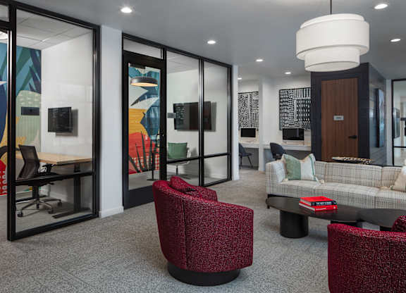 a lounge area with chairs and couches and a table at 2929 on Mayfair, Wauwatosa, Wisconsin