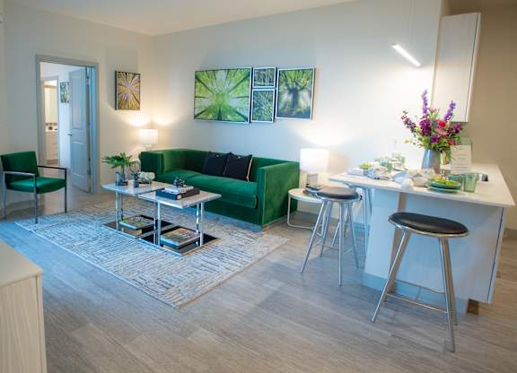 a living room with a kitchen and a couch and a table at 42 Hundred On The Lake, Wisconsin