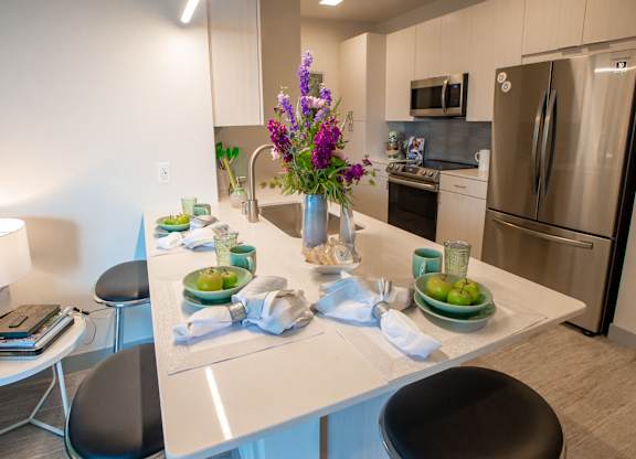 a kitchen with a counter with plates of fruit on it at 42 Hundred On The Lake, St Francis, WI