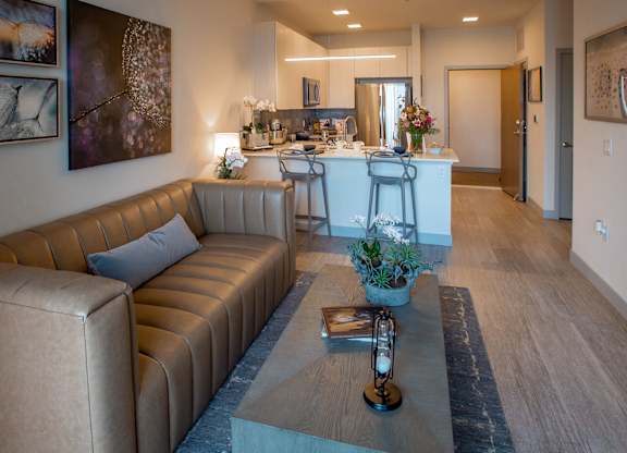 a living room with a couch and a coffee table at 42 Hundred On The Lake, St Francis, 53235