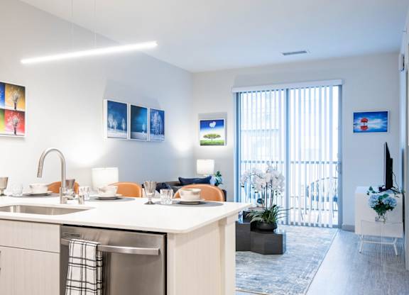 A modern kitchen with a dishwasher and a sink. at Elevate Apartments, Madison, WI, 53718