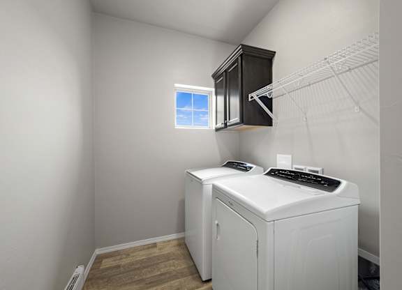 A laundry room with a washer and dryer.