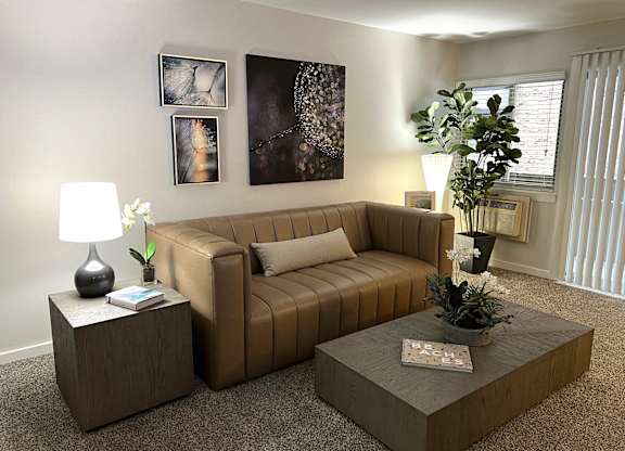a living room with a couch and a coffee table t Fieldpointe of Schaumburg, Illinois