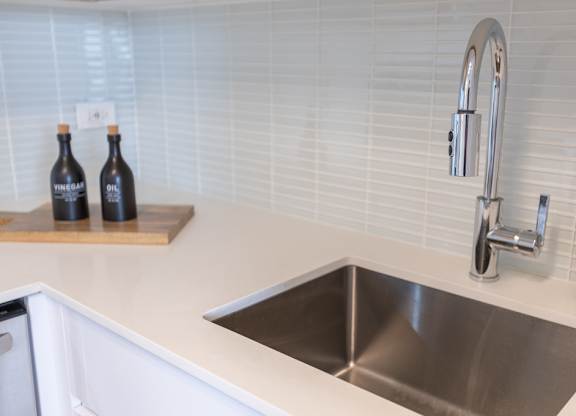 a kitchen with a sink and a faucet at The Kent, Chicago, IL, 60614